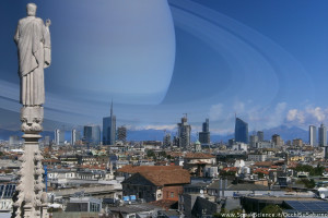 Una vista dei tetti di Milano, se Saturno prendesse il posto della Luna nel cielo. Una creazione SpeakScience per OcchiSuSaturno2015. Immagine originale.